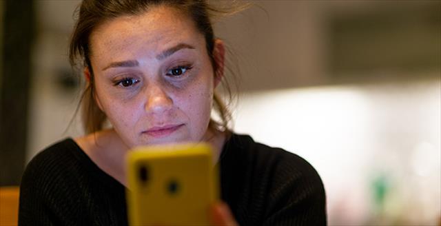 woman reading something on her smartphone