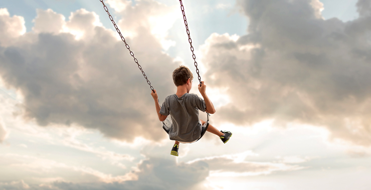 New Zealand Photos  Young girl smiling and sharing a rope swing