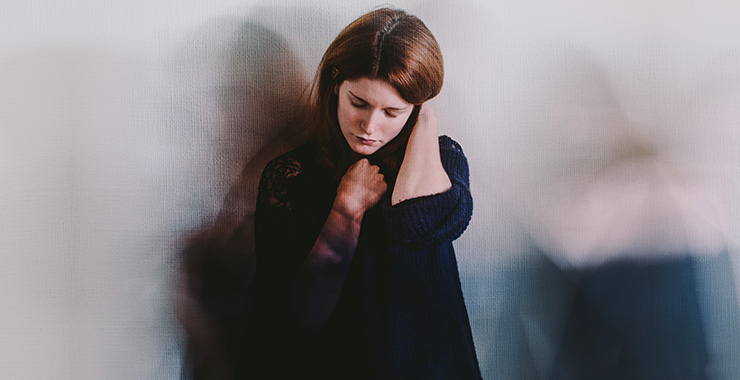 woman looking sad sitting on the floor