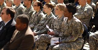 group of military people listening to a presentation