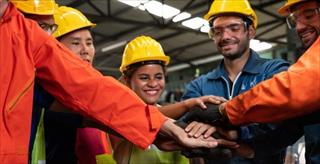 factory employees celebrating teamwork