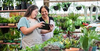 woman with Down Syndrome working in small business