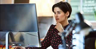 Woman looking at computer screen