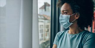 Woman wearing mask indoors