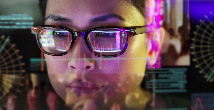 Reflection of computer screen on a woman's face