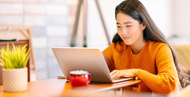 Woman looking at her laptop