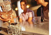 Bartender pouring drinks